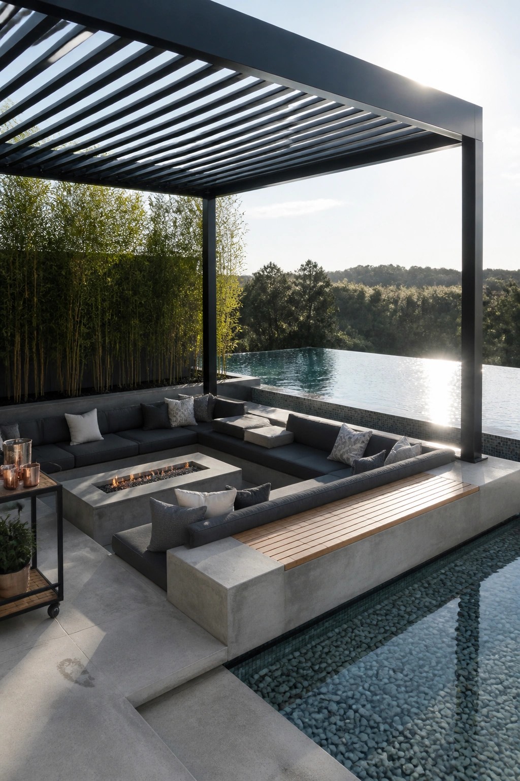 A modern outdoor lounge with a black metal pergola featuring a slatted roof, built-in gray seating around a concrete fire pit, and an adjacent infinity pool with pebble-lined edges.