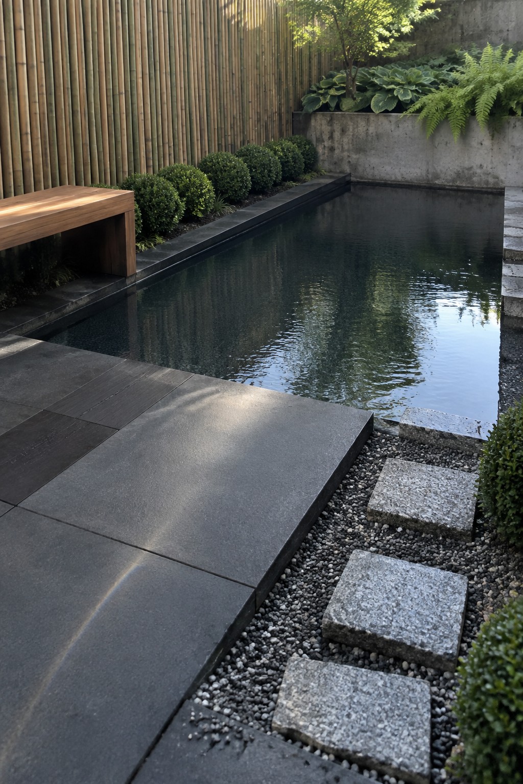 16 Natural Plunge Pool Ideas With Organic Landscaping Rectangular reflecting pool beside bamboo wall with stone stepping stones and wooden bench