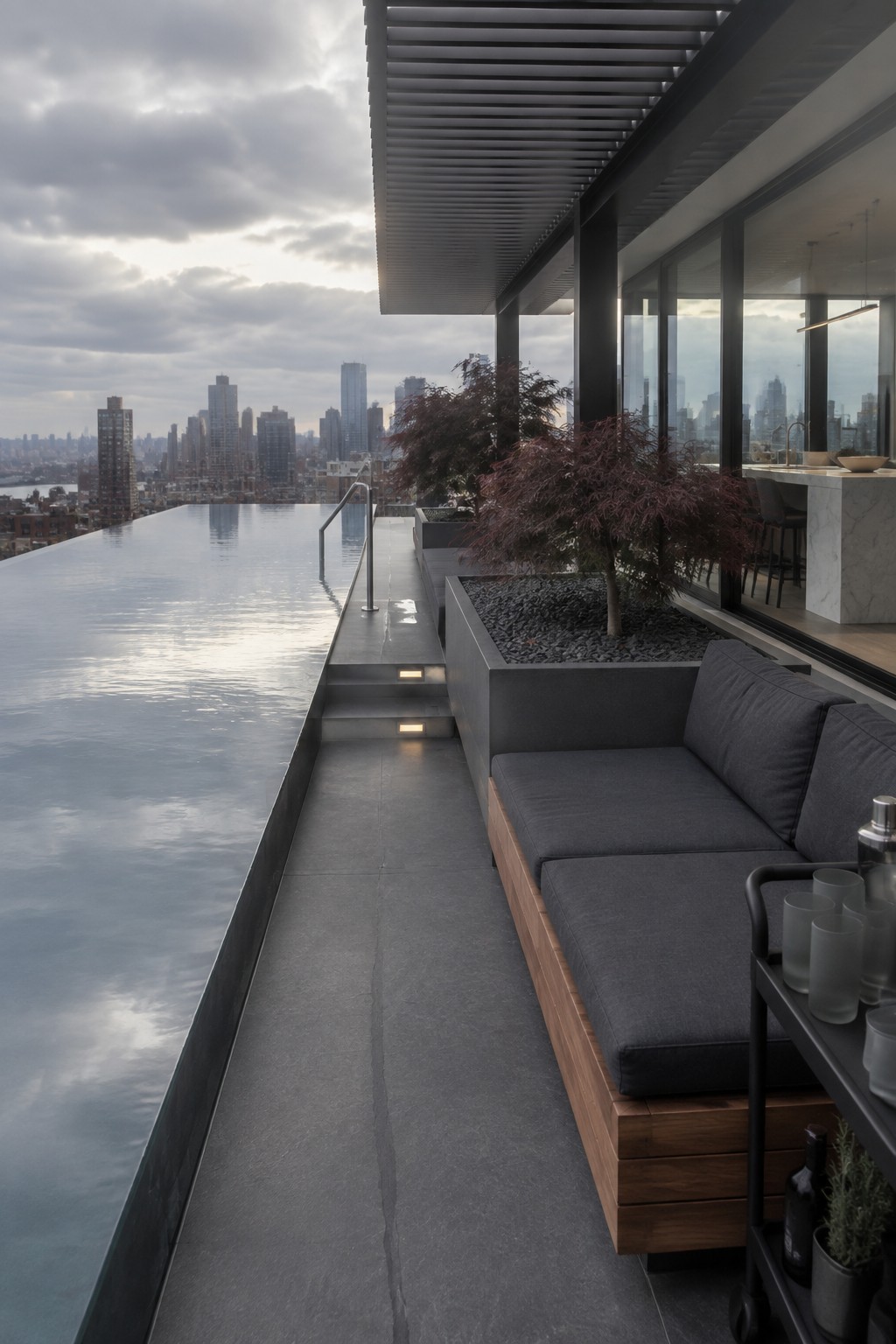 19 Modern Infinity Pool Ideas Featuring Clean Architectural Lines Modern rooftop terrace with infinity pool, dark gray sofa, and city skyline view